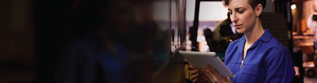 Woman looking down at her tablet