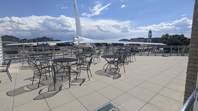 chairs outdoors with a plane